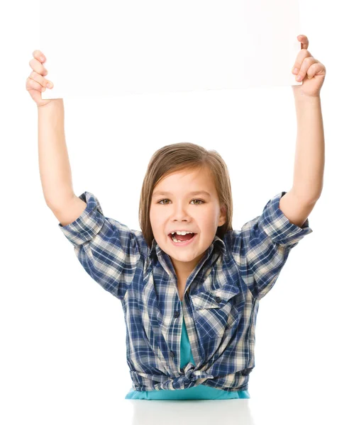 Little girl is holding a blank banner — Stock Photo, Image