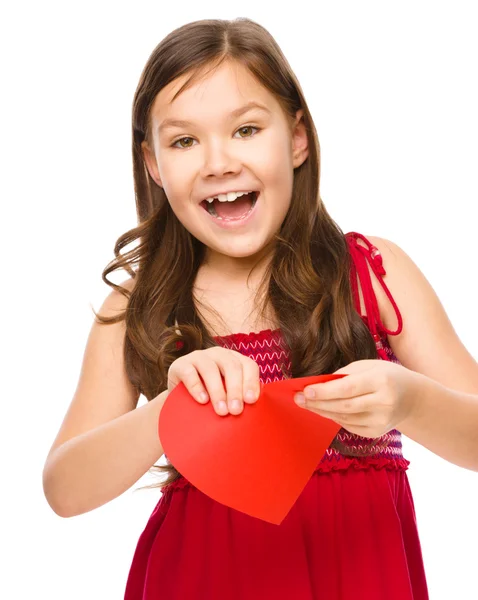 Portrait of a happy little girl in red — Stock Photo, Image