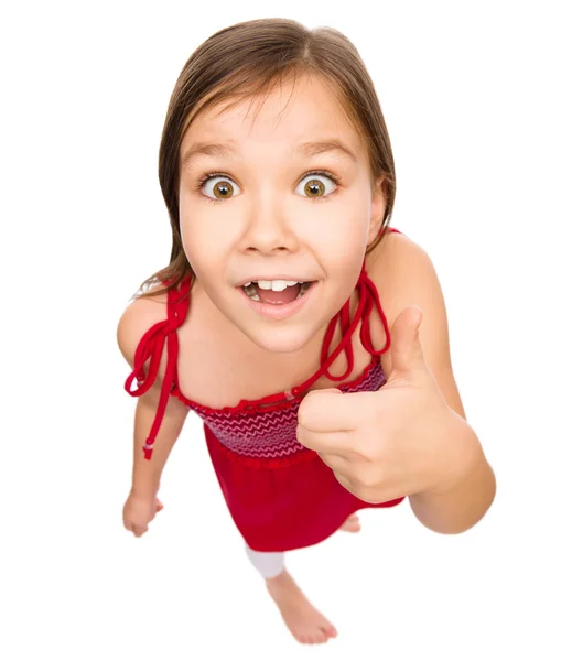 Little girl is showing thumb up gesture — Stock Photo, Image