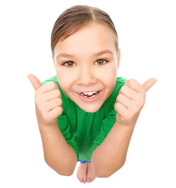 Niña está mostrando el pulgar hacia arriba gesto — Foto de Stock