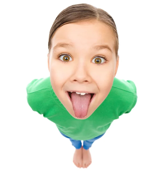 Funny little girl sticking her tongue out — Stock Photo, Image
