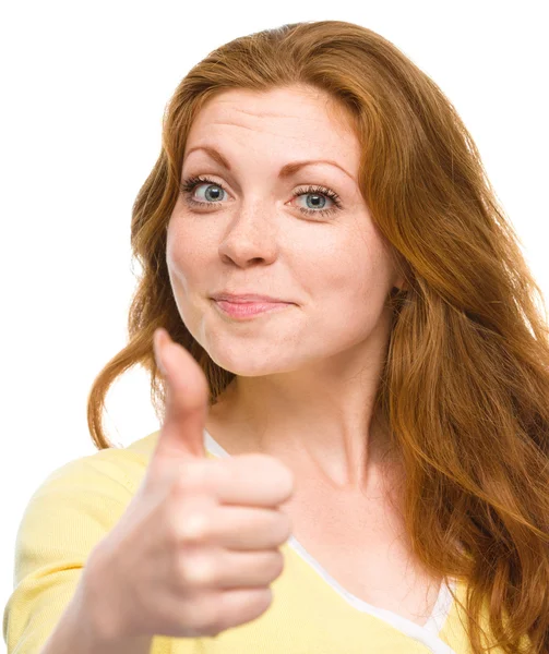 Woman is showing thumb up gesture — Stock Photo, Image