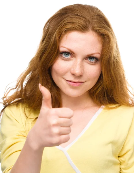 Woman is showing thumb up gesture — Stock Photo, Image