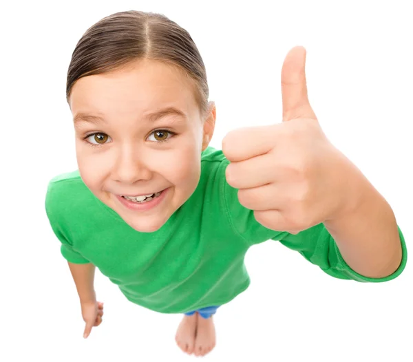 Little girl is showing thumb up gesture — Stock Photo, Image