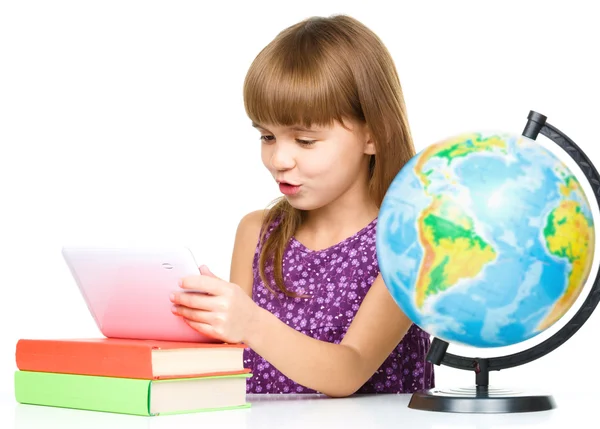 Young girl is using tablet while studying — Stock Photo, Image