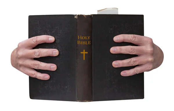 キリスト教の聖書を持つ手は拘束力のある黄金のタイトルで開きます 白地に隔離された — ストック写真