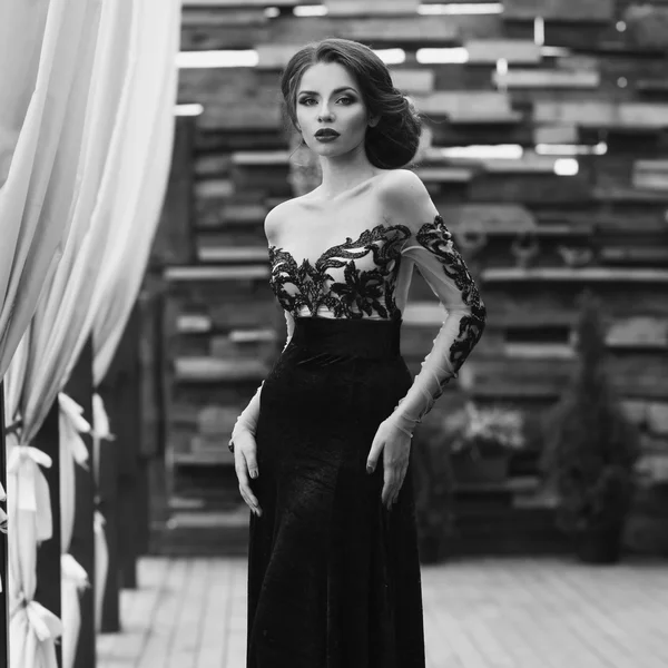 Woman in black lacy evening dress — Stock Photo, Image