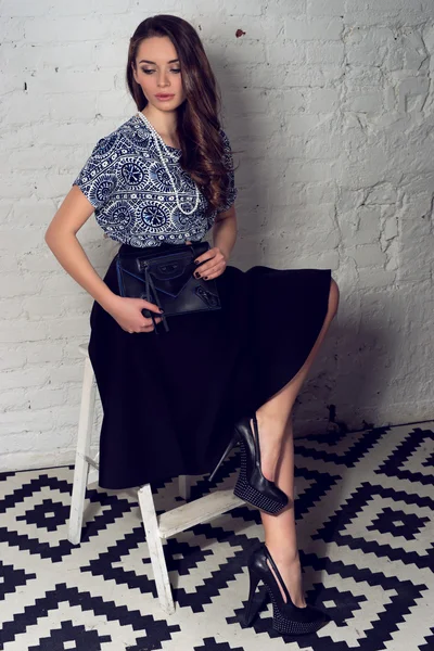 Pretty girl in skirt and blue blouse — Stock Photo, Image