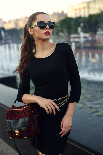 Stylish girl in short black dress. — Stock Photo, Image