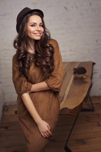 Stylish woman in brown dress — Stock Photo, Image