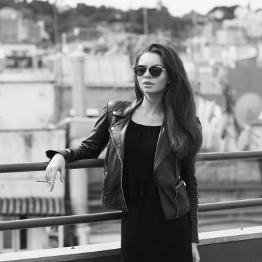 Girl smoking at roof