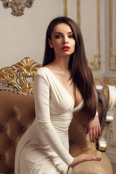 Elegant lady sitting on armchair — Φωτογραφία Αρχείου