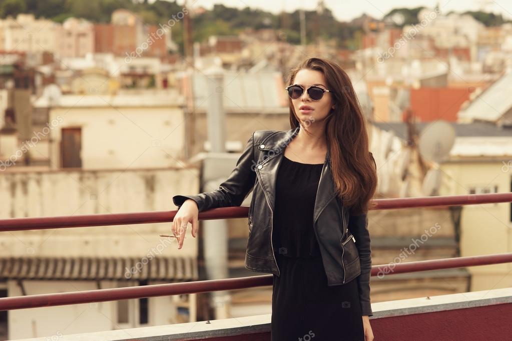 Girl Smoking At Roof Stock Photo Dmitry Tsvetkov 108370922 Young Beautiful Woman In Black Dress And Leather Jacket Standing At Roof Near Fence Smoking Photo By
