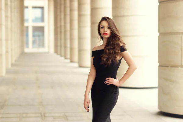 Pretty beautiful business woman in elegant black dress — Stock Photo, Image