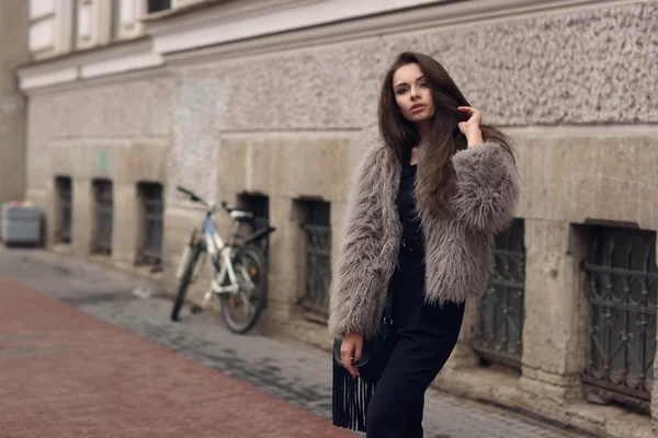 Stylish girl in fur coat — Stock Photo, Image