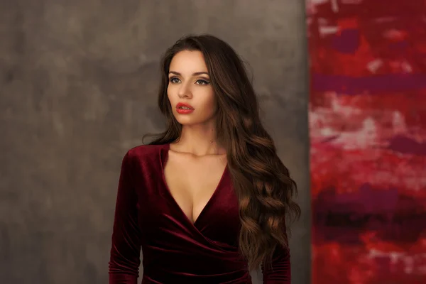 Stunning girl in cherry red dress — Stock Photo, Image