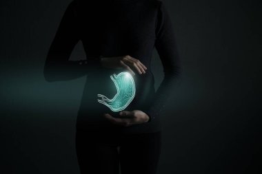 Vurgulanmış mide organı gösterişsiz çizim. Koyu yeşil arka planda bir kadın cesedi. Bağışıklık sistemi detoksu, probiyotik ve enzim konsepti. 