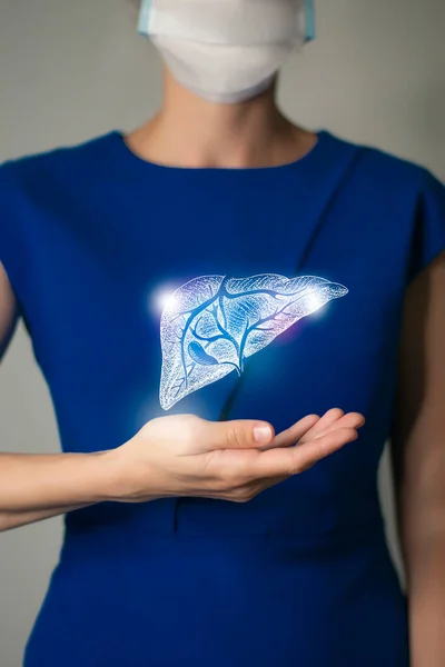 Woman in blue clothes holding virtual Liver in hand. Handrawn human organ, detox and healthcare, healthcare hospital service concept stock photo