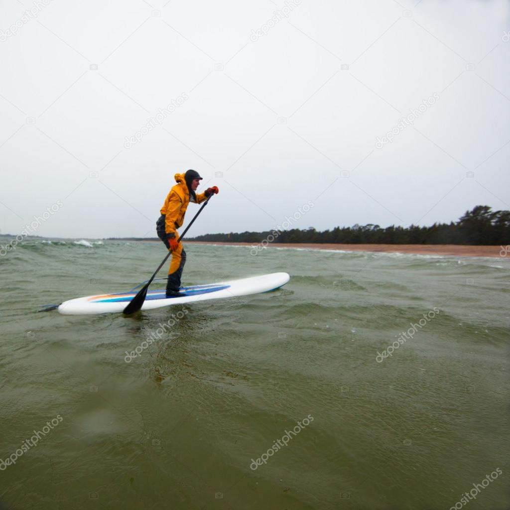 Woman on a stand up paddle board