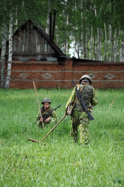 JURGA, SIBERIA, RUSSIA - JUNE 6,2011:A Sappers clearing an explosive device in a minefield