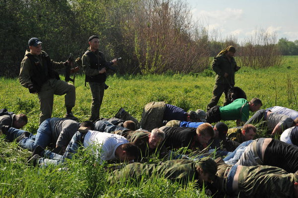 JURGA, SIBERIA, RUSSIA - JUNE 7,2011:Hostages taken prisoner. Courses for war correspondents "Bastion", rules of conduct in captivity.