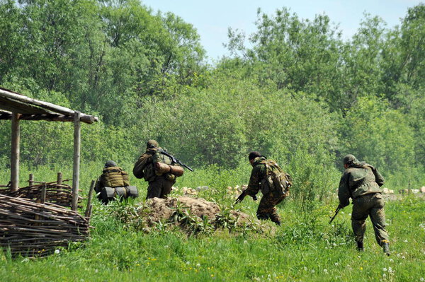 ISKITIM, SIBERIA, RUSSIA - JUNE 8,2011:Soldiers of a special forces unit practice combat operations in a village at a military training ground