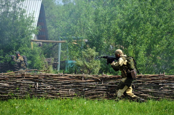 ISKITIM, SIBERIA, RUSSIA - JUNE 8,2011:Soldiers of a special forces unit practice combat operations in a village at a military training ground