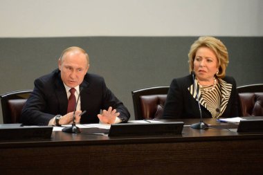 MOSCOW, RUSSIA - FEBRUARY 28, 2019:Russian President Vladimir Putin and the President of the Council of Federation of the Federal Assembly of the Russian Federation Valentina Matvienko. clipart