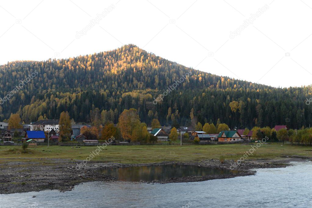 ALTAI REPUBLIC, RUSSIA - SEPTEMBER 28, 2020:Iogach village of the Altai Republic near the source of the Biya River flowing from Lake Teletskoye, at the foot of Mount Keitek