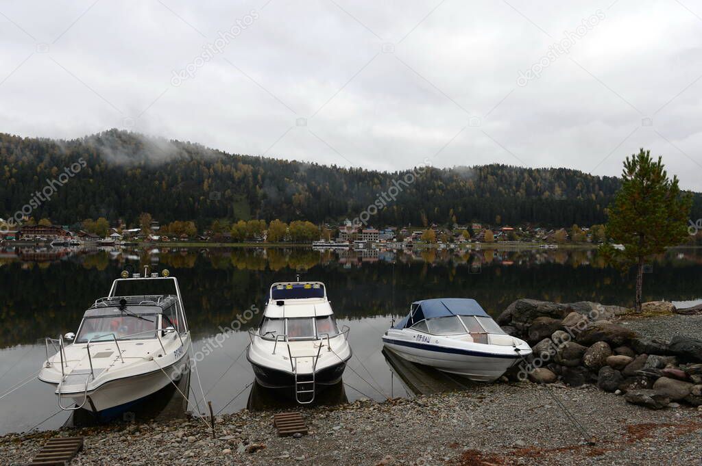 ALTAI REPUBLIC, RUSSIA - SEPTEMBER 27, 2020:The boat sank on the shore of Lake Teletskoye in the village of Iogach. Altai Republic