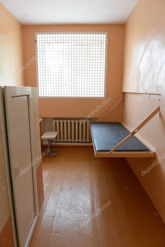    BRYANSK, RUSSIA - JUNE 7, 2012:A folding bed in a punishment cell in a Russian penal colony