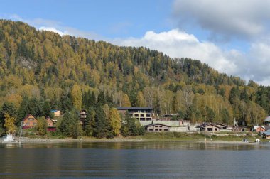 ALTAI REPUBLIC, RUSSIA - SEPTEMBER 27, 2020: Taiga village of Artybash on the shore of Lake Teletskoye. Altai Republic