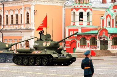 MOSCOW, RUSSIA-MAY 9, 2021:T-34-85 medium tank with a red banner on Red Square during the parade dedicated to the 76th anniversary of the Victory in the Great Patriotic War
