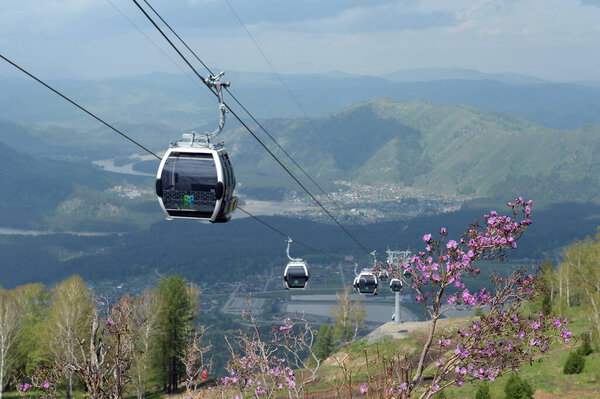 MANZHEROK, ALTAI REPUBLIC, RUSSIA -  MAY 19, 2021:Cable lift at the resort "Manzherok" in the Altai Mountains