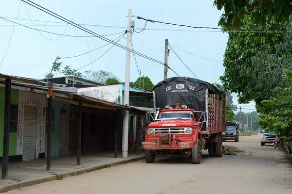 The truck on  street on  of the town. — Stock Photo, Image