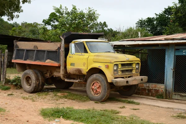 The truck on  street on  of the town. — Stock Photo, Image