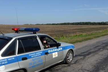Filming from the window of a police car