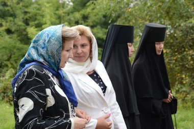 Valentina Tereshkova and Tatiana Moskalkova in piously-Vvedensky Tolga convent clipart