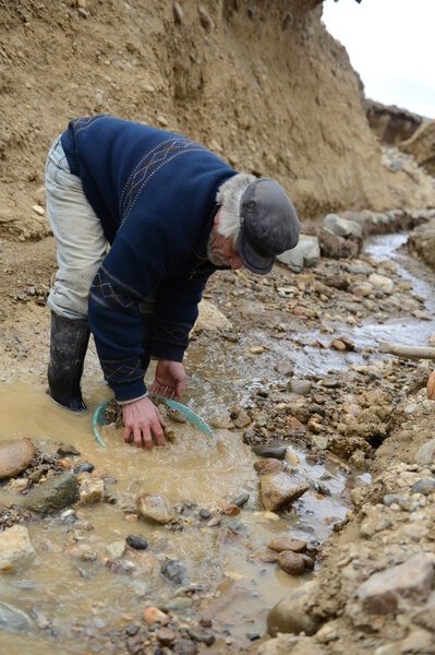 Miner washing gold in Tierra del Fuego.