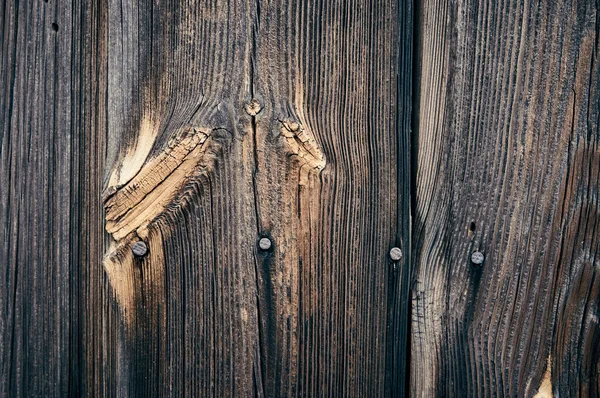 Stará hnědá povrch vzorku přírodní dřevěné dekorativní zdi textury povrchu s uzly v detailech. — Stock fotografie