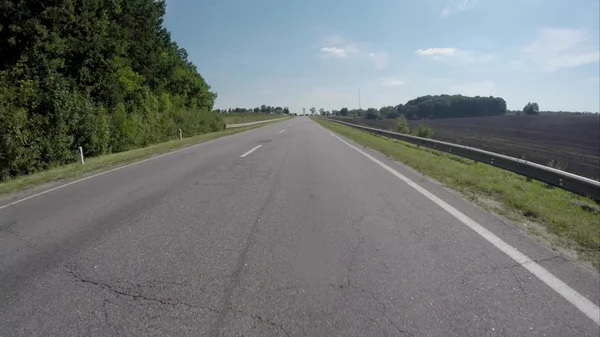 Driving on the highway near the forest — Stock Photo, Image