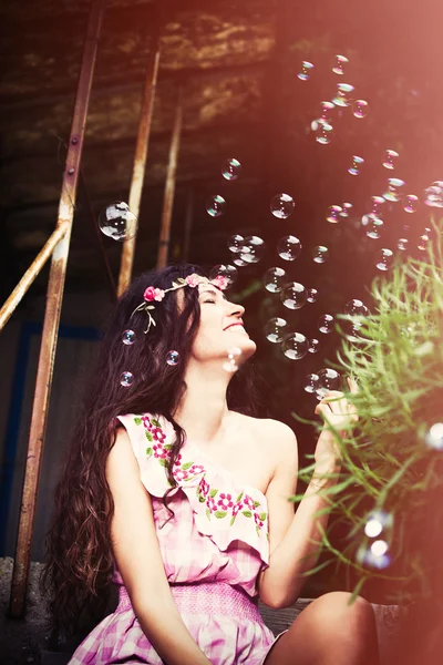 Smiling woman and bubbles — Stock Photo, Image