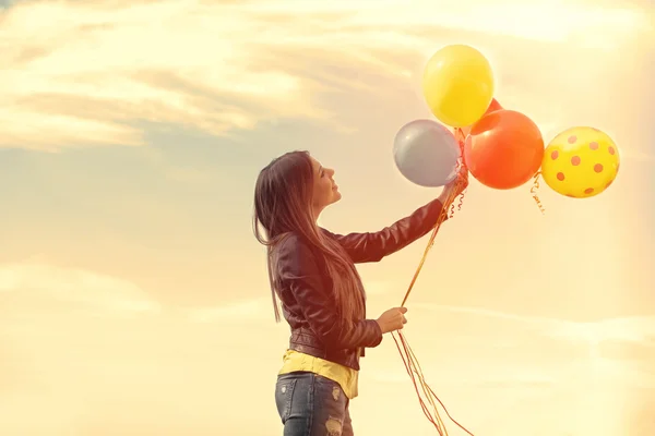 Happy girl with balloons — Stock Photo, Image