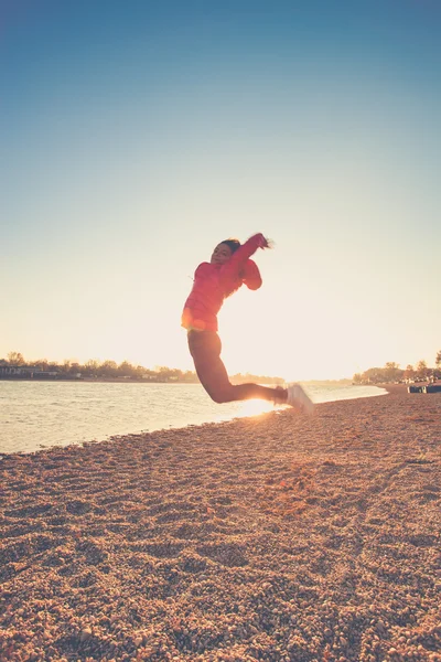 Jump on beach — Stock Photo, Image