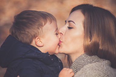 son and mom kissing clipart
