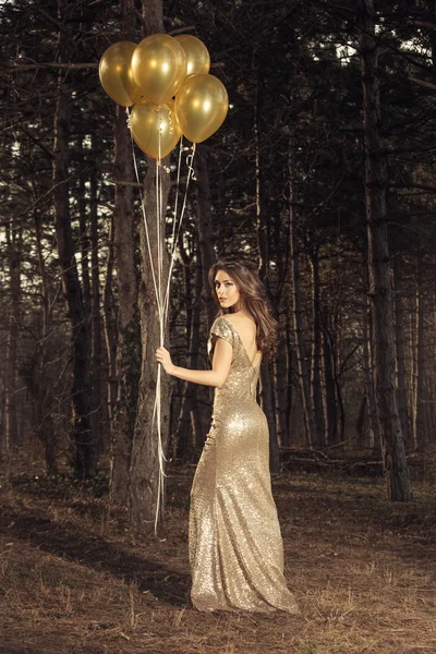 Elegant woman with balloons in wood — Stock Photo, Image