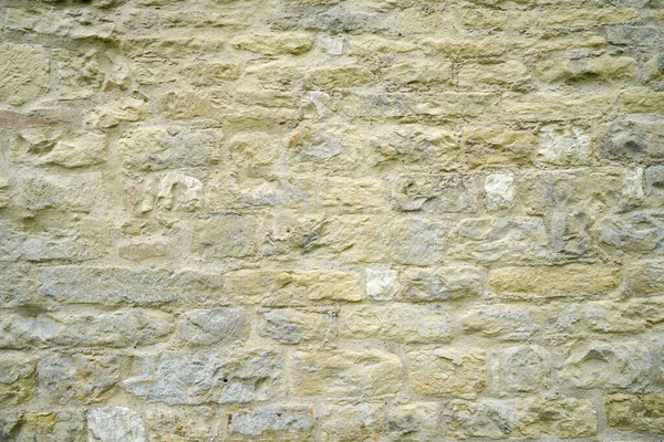 石の壁の強い構造で 日光の下で撮影レンガ — ストック写真