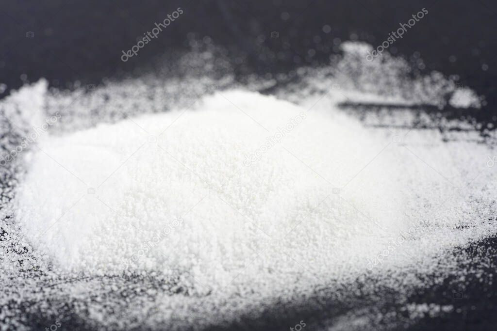 Flour with macro lens photographed against colorful gradient in studio