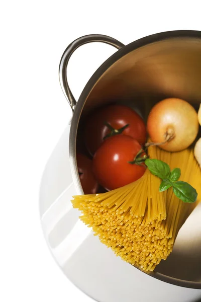 Spaghetti in pot with ingredients — Stock Photo, Image