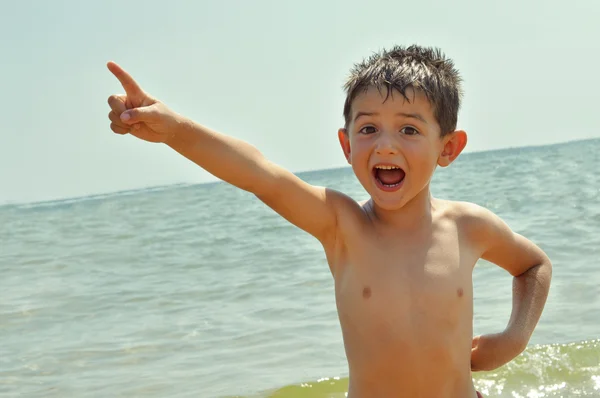 Muestra niño con el dedo — Foto de Stock